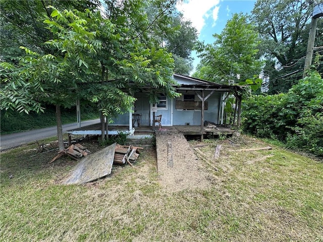 22 Honeysuckle Ln, Dahlonega, GA 30533 - rear view of house with covered porch and a yard