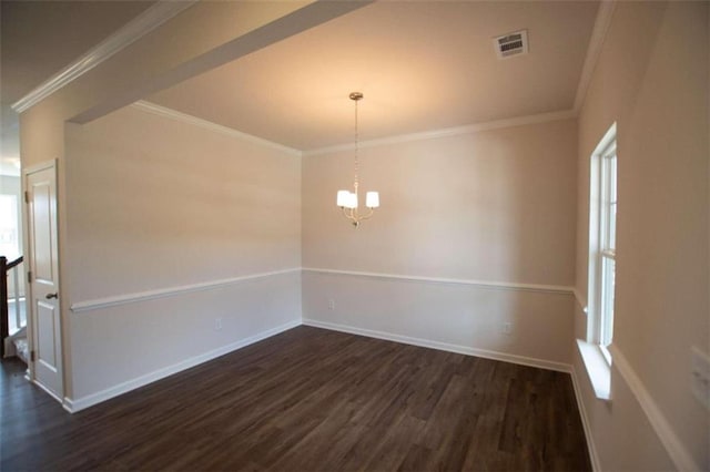 spare room featuring a wealth of natural light, crown molding, and dark hardwood / wood-style floors