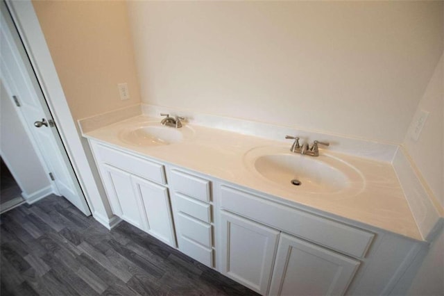 bathroom featuring vanity and wood-type flooring