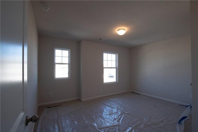 530 River Run Dr, Dallas, GA 30132 - unfurnished room featuring healthy amount of natural light, a smoke detector, and baseboards