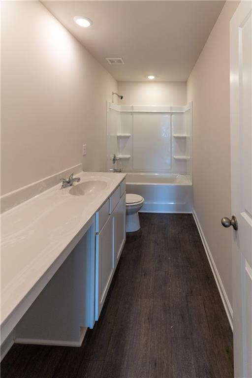 530 River Run Dr, Dallas, GA 30132 - full bathroom with toilet, vanity, wood finished floors, shower / bathtub combination, and recessed lighting