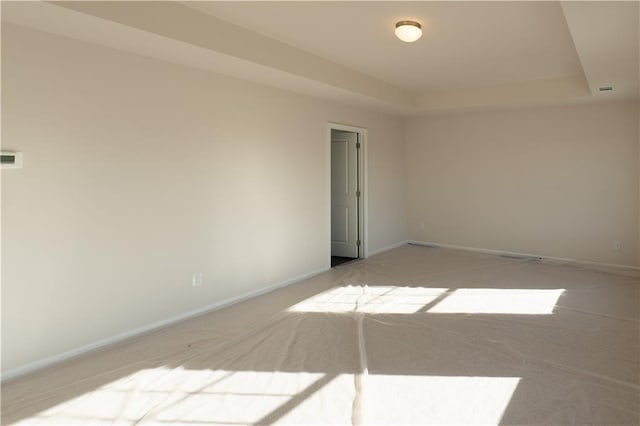 530 River Run Dr, Dallas, GA 30132 - empty room with light carpet, baseboards, and a raised ceiling