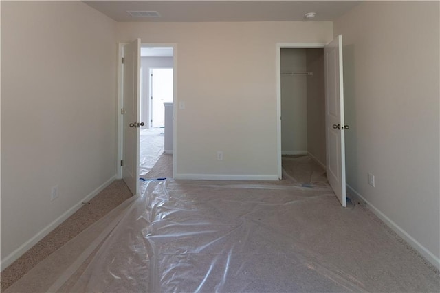530 River Run Dr, Dallas, GA 30132 - unfurnished bedroom with baseboards, a closet, and a walk in closet
