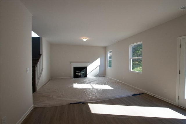 530 River Run Dr, Dallas, GA 30132 - unfurnished living room with baseboards, wood finished floors, and a fireplace with flush hearth