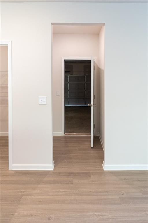530 River Run Dr, Dallas, GA 30132 - hallway featuring baseboards and light wood-type flooring