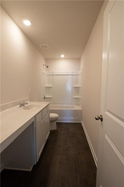 530 River Run Dr, Dallas, GA 30132 - bathroom with toilet, vanity, bathing tub / shower combination, wood finished floors, and recessed lighting