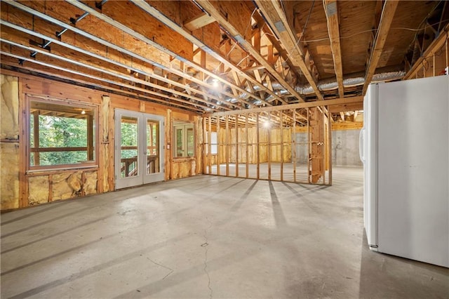 basement featuring freestanding refrigerator