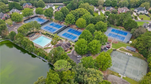 birds eye view of property with a water view and a residential view