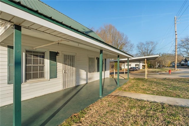 view of home's exterior featuring a carport