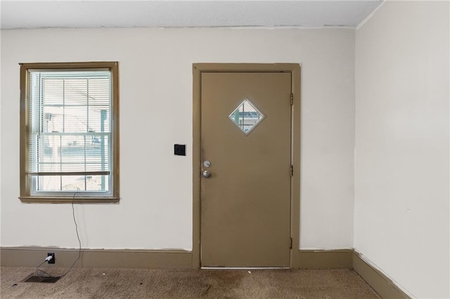 view of carpeted entrance foyer