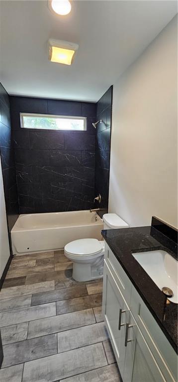 185 Glenrose Cir SW, Atlanta, GA 30354 - bathroom with bathing tub / shower combination, plenty of natural light, vanity, and toilet