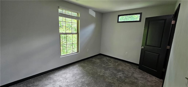 185 Glenrose Cir SW, Atlanta, GA 30354 - spare room featuring dark carpet and baseboards