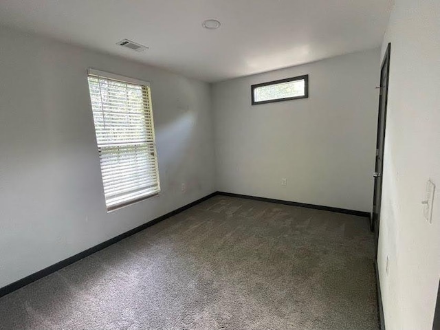 185 Glenrose Cir SW, Atlanta, GA 30354 - empty room with dark carpet and baseboards
