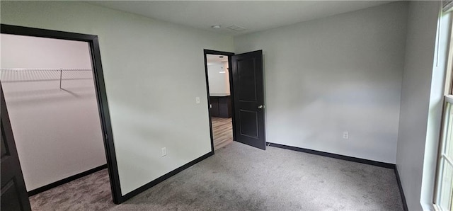 185 Glenrose Cir SW, Atlanta, GA 30354 - unfurnished bedroom with carpet floors, baseboards, and a closet