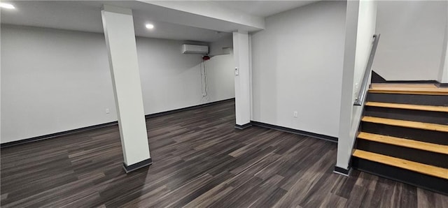 185 Glenrose Cir SW, Atlanta, GA 30354 - finished below grade area with wood finished floors, a wall mounted AC, recessed lighting, baseboards, and stairs