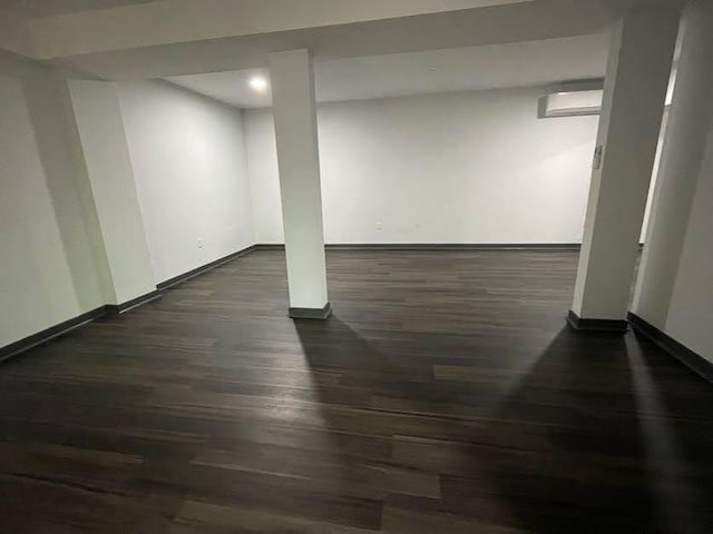 185 Glenrose Cir SW, Atlanta, GA 30354 - finished basement with dark wood-style floors, baseboards, a wall mounted AC, and recessed lighting