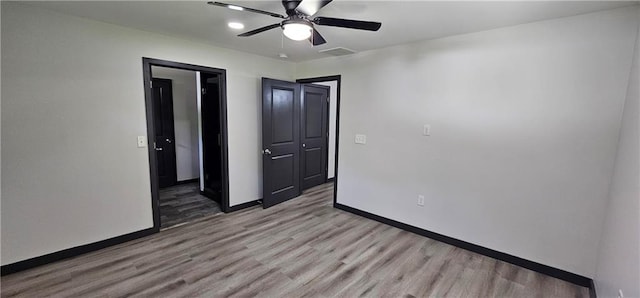 185 Glenrose Cir SW, Atlanta, GA 30354 - unfurnished bedroom with light wood-style floors, baseboards, and ceiling fan