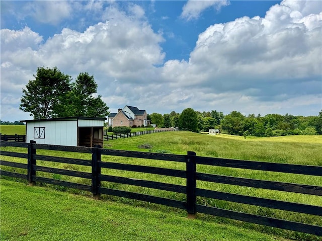 311 Langston Rd SE, Calhoun, GA 30701 - gate featuring an outdoor structure, a rural view, and an outbuilding