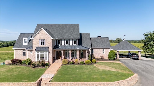 311 Langston Rd SE, Calhoun, GA 30701 - view of front of home featuring a porch and brick siding