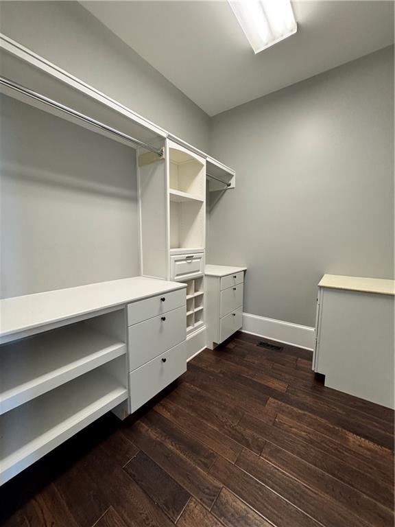 311 Langston Rd SE, Calhoun, GA 30701 - spacious closet with dark wood-style flooring