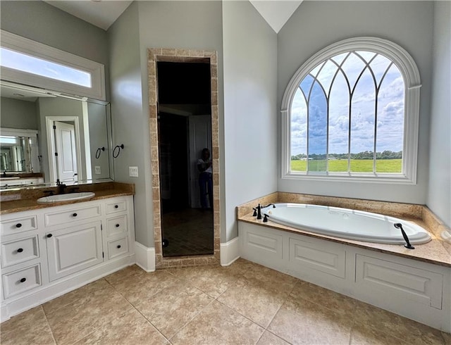 311 Langston Rd SE, Calhoun, GA 30701 - bathroom featuring a bath, vanity, healthy amount of natural light, and a stall shower