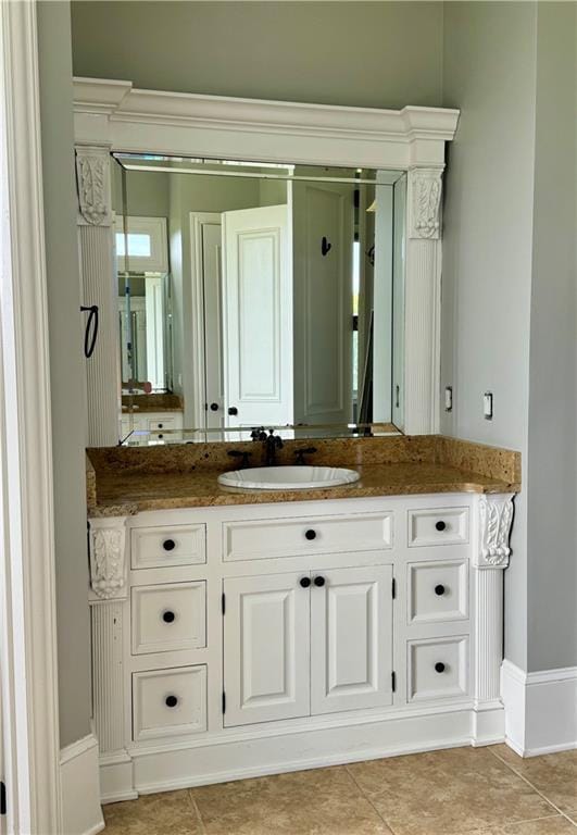 311 Langston Rd SE, Calhoun, GA 30701 - bathroom with vanity, tile patterned floors, and baseboards