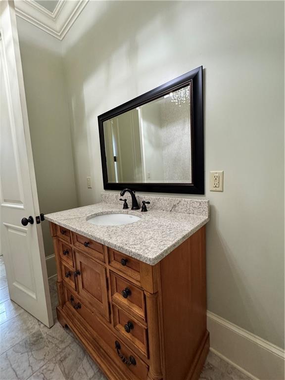311 Langston Rd SE, Calhoun, GA 30701 - bathroom with vanity and ornamental molding