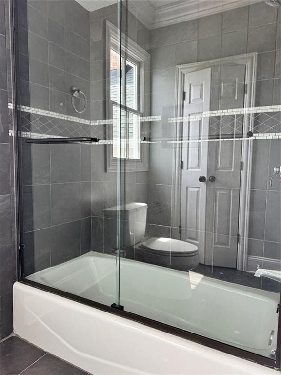 311 Langston Rd SE, Calhoun, GA 30701 - full bath featuring enclosed tub / shower combo, toilet, and tile patterned floors