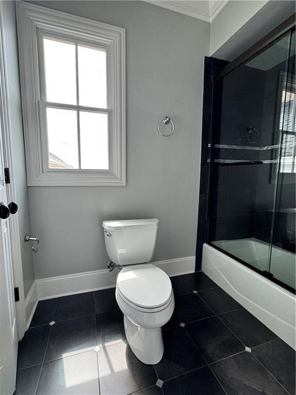 311 Langston Rd SE, Calhoun, GA 30701 - full bathroom featuring toilet, bath / shower combo with glass door, plenty of natural light, baseboards, and crown molding