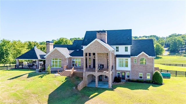 311 Langston Rd SE, Calhoun, GA 30701 - rear view of property with a chimney, brick siding, a patio, and a deck