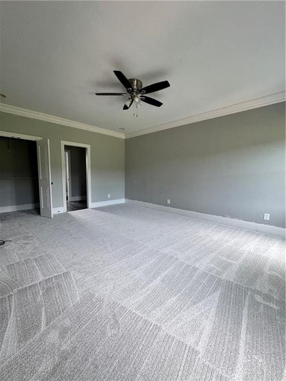 311 Langston Rd SE, Calhoun, GA 30701 - unfurnished bedroom with crown molding, baseboards, carpet, and a ceiling fan