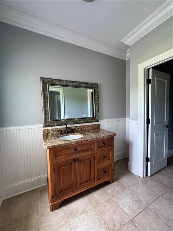 311 Langston Rd SE, Calhoun, GA 30701 - bathroom featuring crown molding, wainscoting, vanity, and tile patterned floors