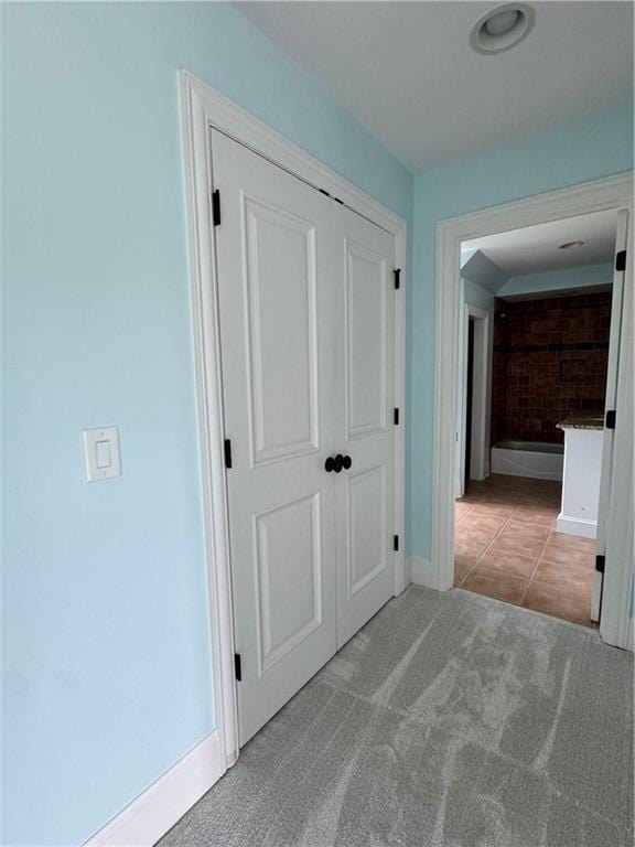 311 Langston Rd SE, Calhoun, GA 30701 - corridor with baseboards, carpet floors, and tile patterned floors