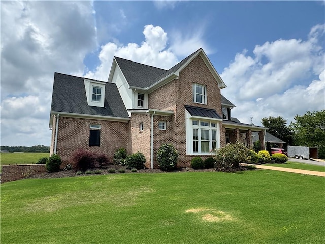 311 Langston Rd SE, Calhoun, GA 30701 - view of front of house with brick siding, a front yard, and a shingled roof