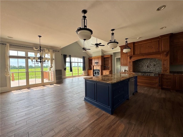 311 Langston Rd SE, Calhoun, GA 30701 - kitchen with dark wood finished floors, a center island, vaulted ceiling, tasteful backsplash, and a chandelier