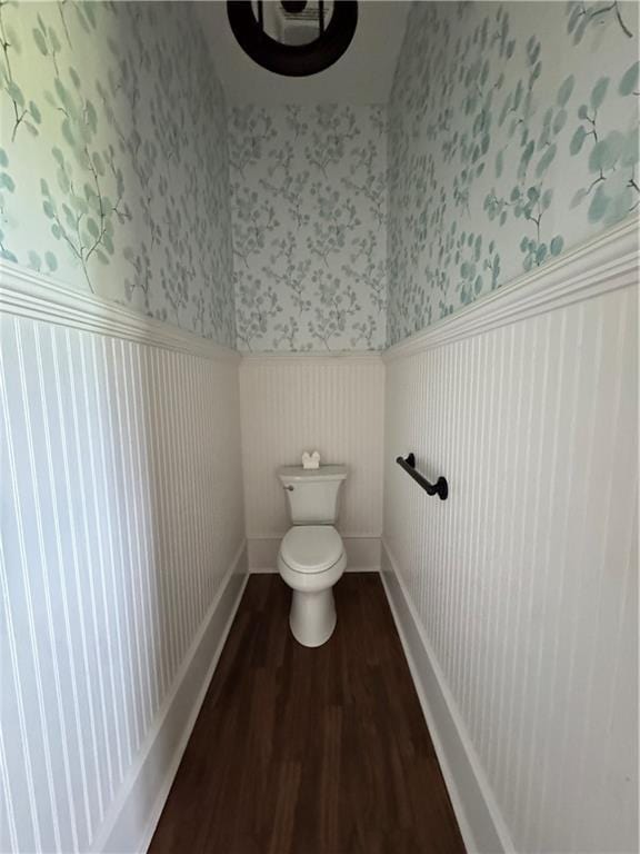 311 Langston Rd SE, Calhoun, GA 30701 - bathroom featuring a wainscoted wall, wallpapered walls, wood finished floors, toilet, and baseboards