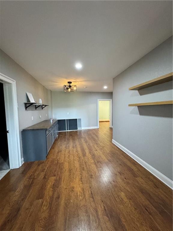 311 Langston Rd SE, Calhoun, GA 30701 - unfurnished living room featuring dark wood-style floors, baseboards, and recessed lighting