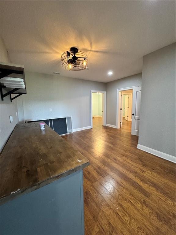 311 Langston Rd SE, Calhoun, GA 30701 - unfurnished living room featuring dark wood-style floors, baseboards, and a ceiling fan