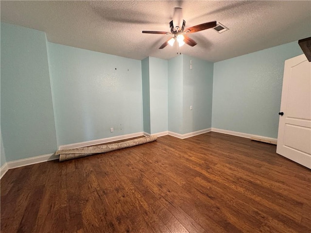 311 Langston Rd SE, Calhoun, GA 30701 - unfurnished room featuring a textured ceiling, wood finished floors, ceiling fan, and baseboards