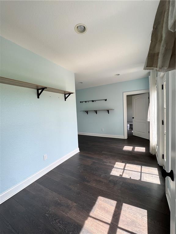 311 Langston Rd SE, Calhoun, GA 30701 - unfurnished room featuring wood finished floors and baseboards