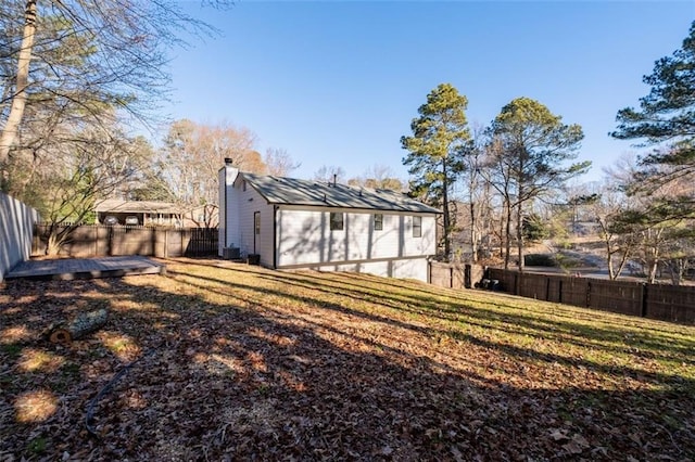 2571 Hamill Dr, Buford, GA 30519 - back of house featuring a chimney and central air condition unit