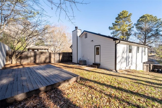2571 Hamill Dr, Buford, GA 30519 - rear view of property featuring a wooden deck, a chimney, central air condition unit, and entry steps