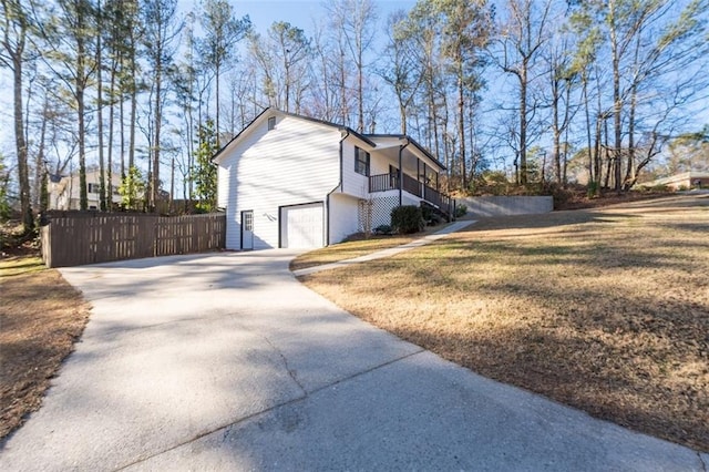 2571 Hamill Dr, Buford, GA 30519 - view of side of property with concrete driveway, a garage, stairs, and a porch