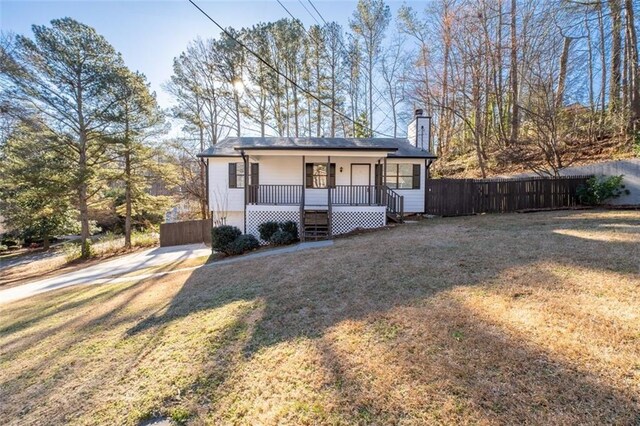 2571 Hamill Dr, Buford, GA 30519 - view of front facade featuring covered porch and a chimney