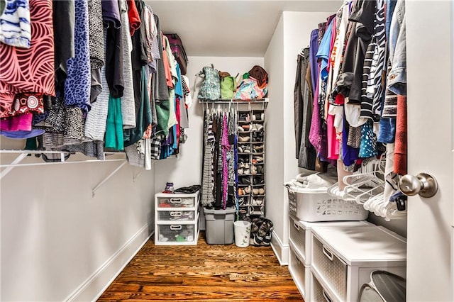 spacious closet featuring wood finished floors