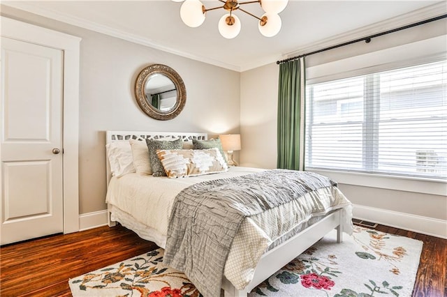 bedroom with crown molding, a notable chandelier, dark wood-style floors, and baseboards