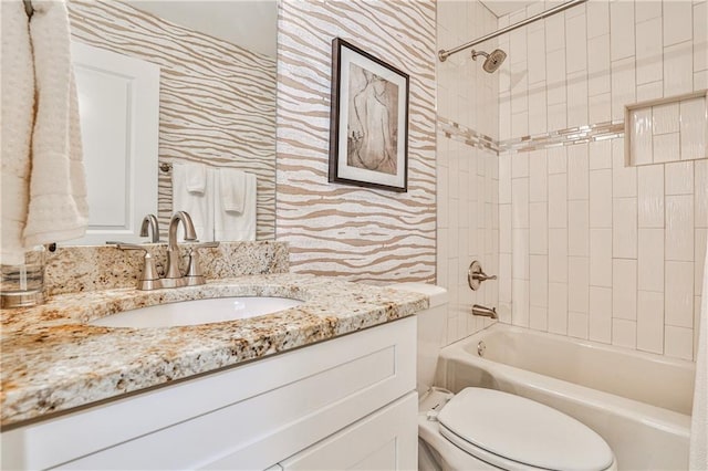 bathroom with vanity, toilet, and shower / bathtub combination