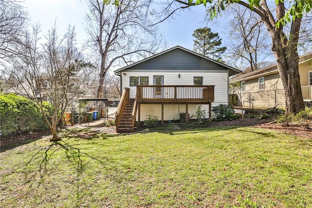 back of house featuring central air condition unit, fence, a yard, a wooden deck, and stairs