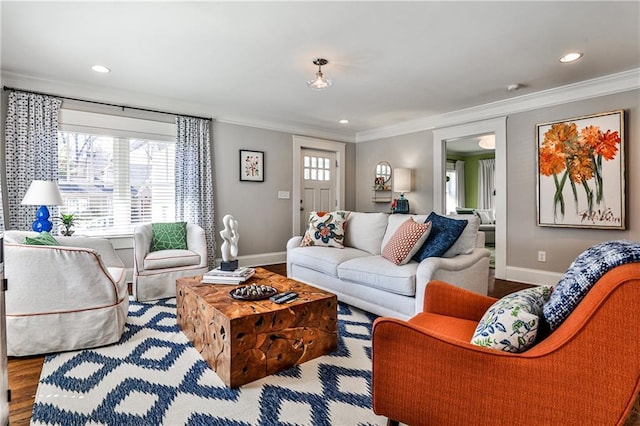 living area with crown molding, recessed lighting, wood finished floors, and baseboards