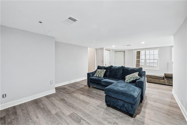 642 Towering Pine Trl, Lawrenceville, GA 30045 - living room featuring baseboards, light wood-style flooring, and recessed lighting